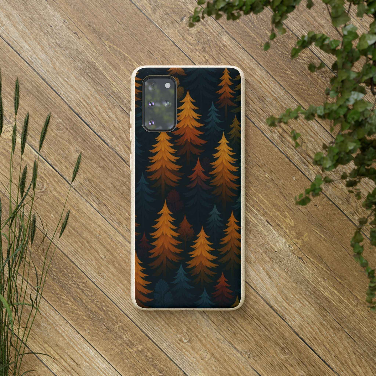 Biodegradable phone case with dark forest and orange pine trees print