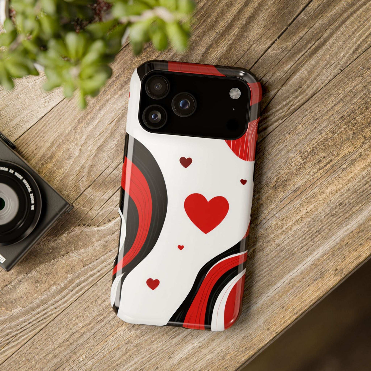 Glossy phone case with large red heart and red-black curves on white