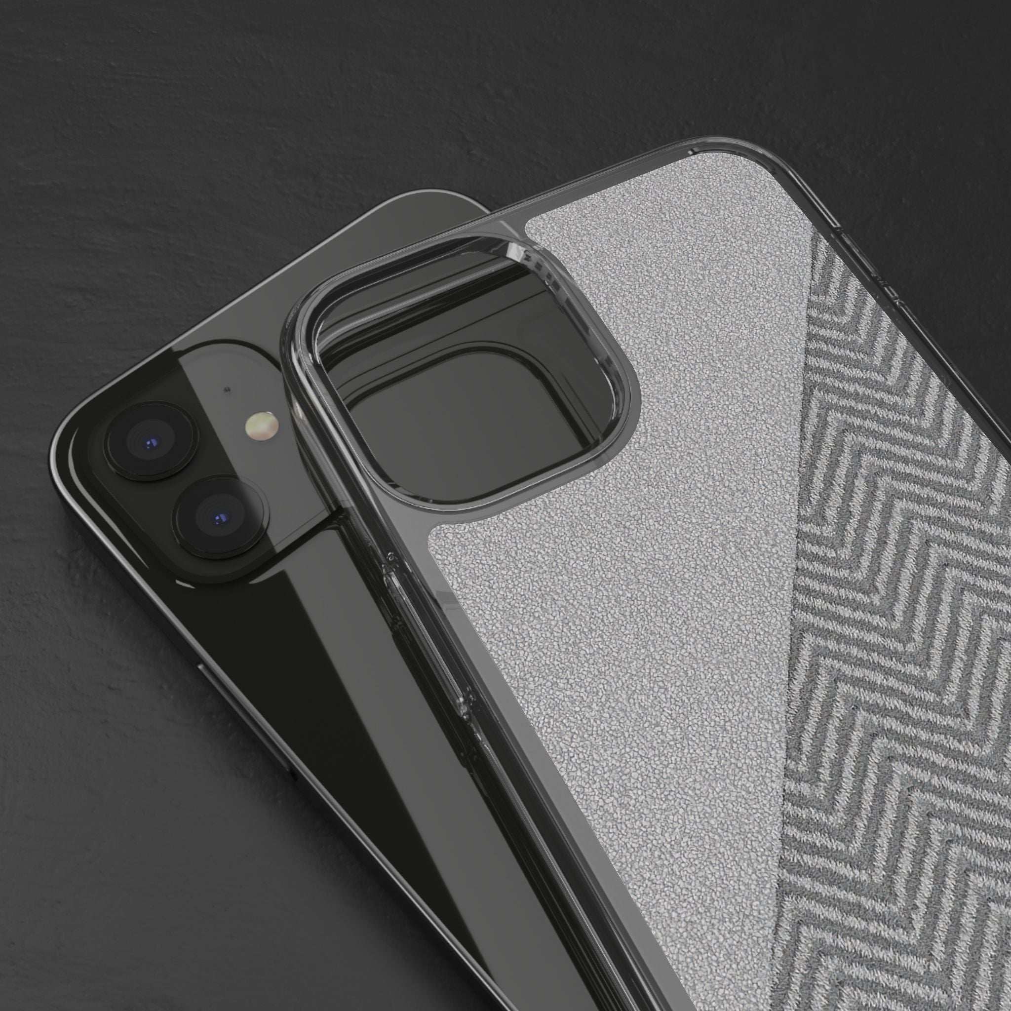 Tough phone case close-up: clear bumper edges over speckled gray herringbone back