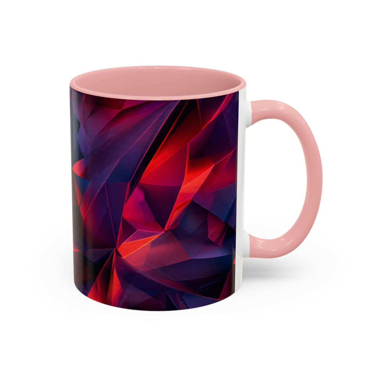 Ceramic accent mug with pink handle and pink rim, faceted red/purple/blue geometric pattern