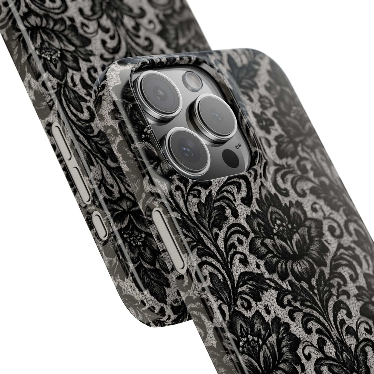 Black damask floral phone case angled view, visible camera bump and side buttons