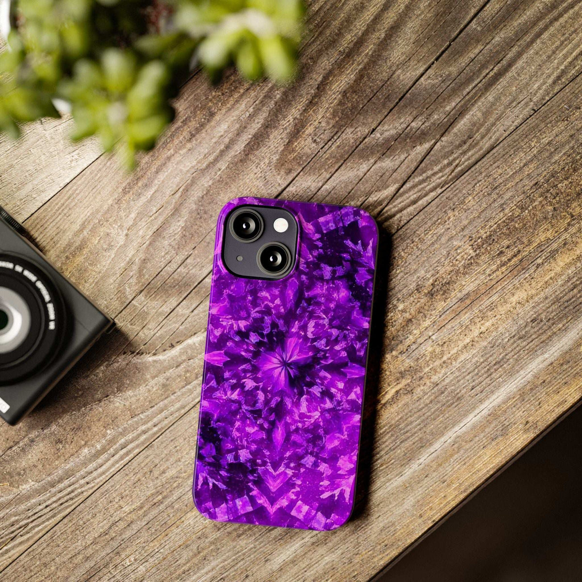 Purple kaleidoscope phone case with flowerburst pattern and rear camera cutouts