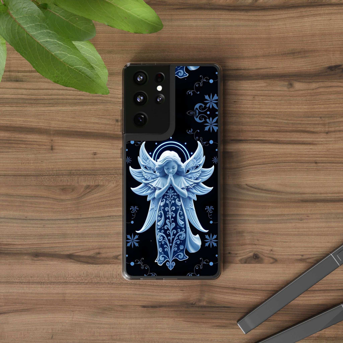 Transparent phone case showing blue angel with wings and decorative floral motifs