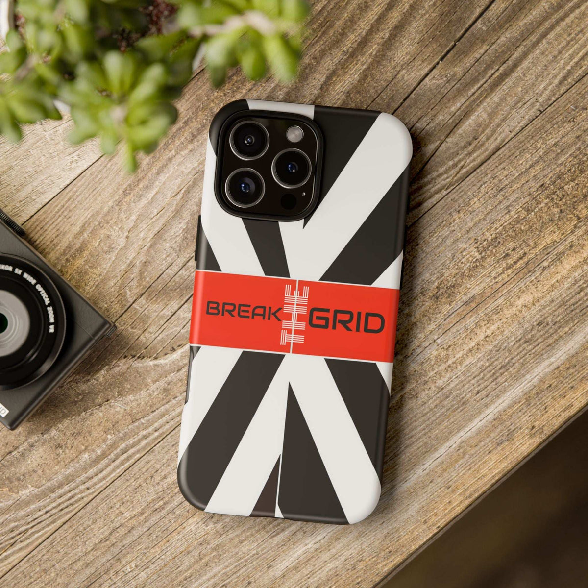 Phone case with bold black-and-white geometric design and red Break the Grid stripe