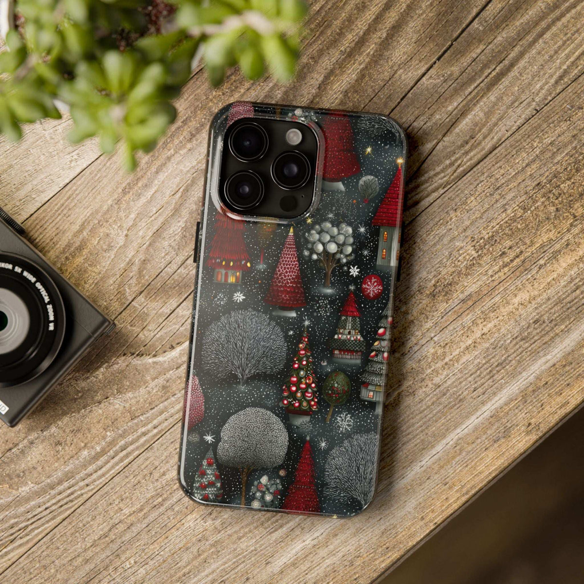 Frosted phone case with dark gray winter forest design and red trees, full back visible