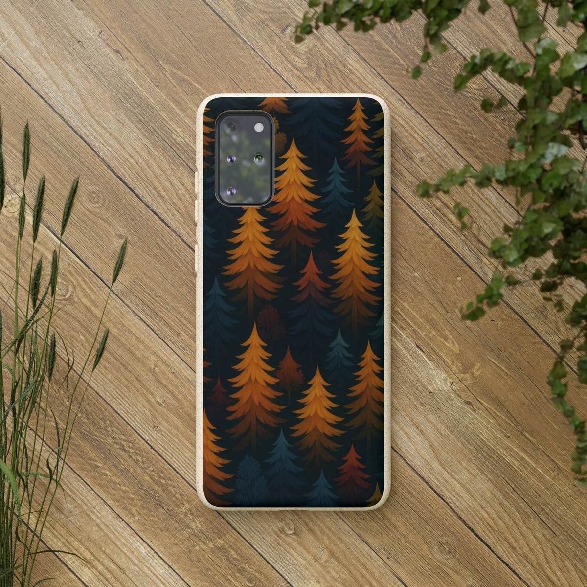 Phone case with dark pine forest artwork and orange trees, speckled border