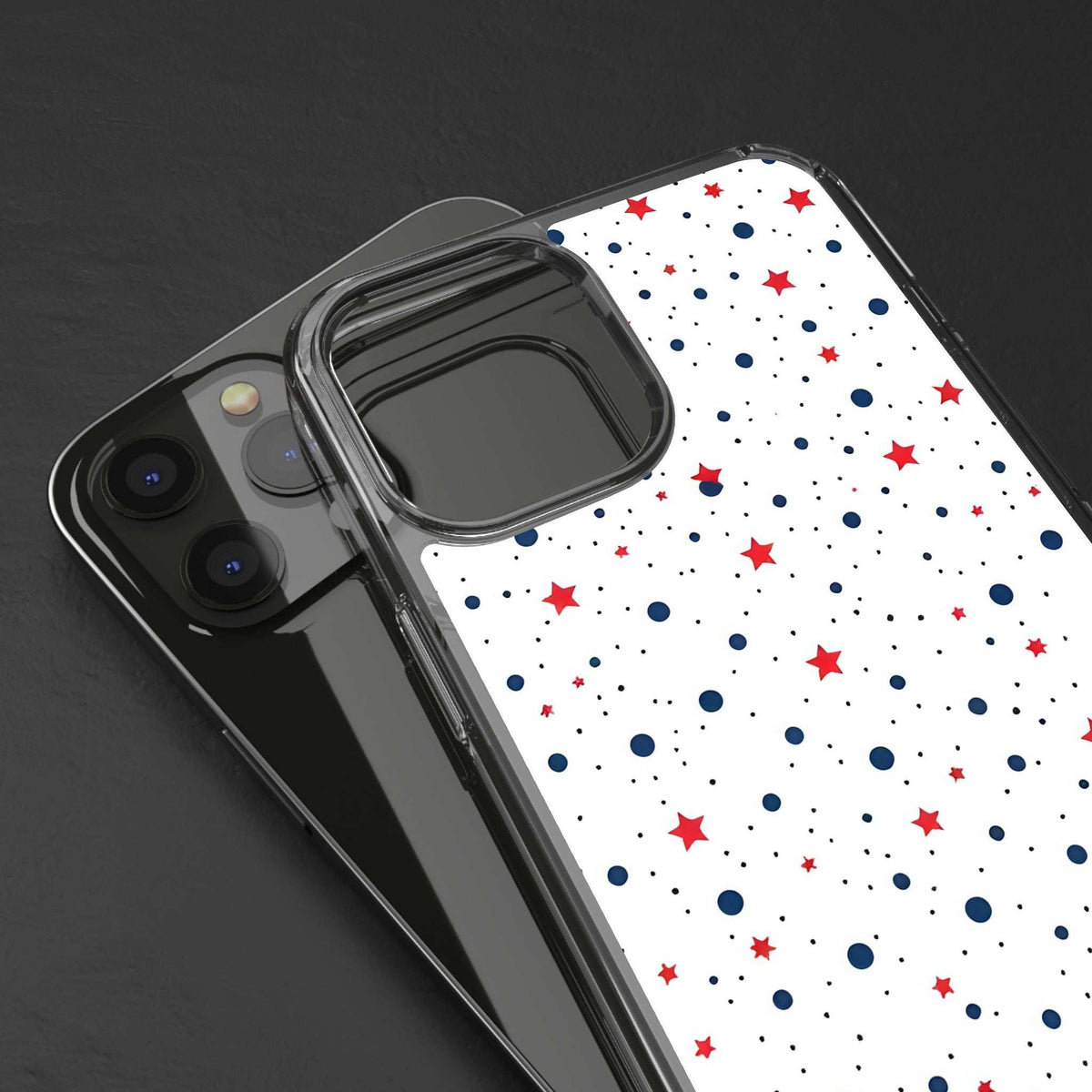 Clear phone case with white star-and-dot pattern in red and blue, camera cutout