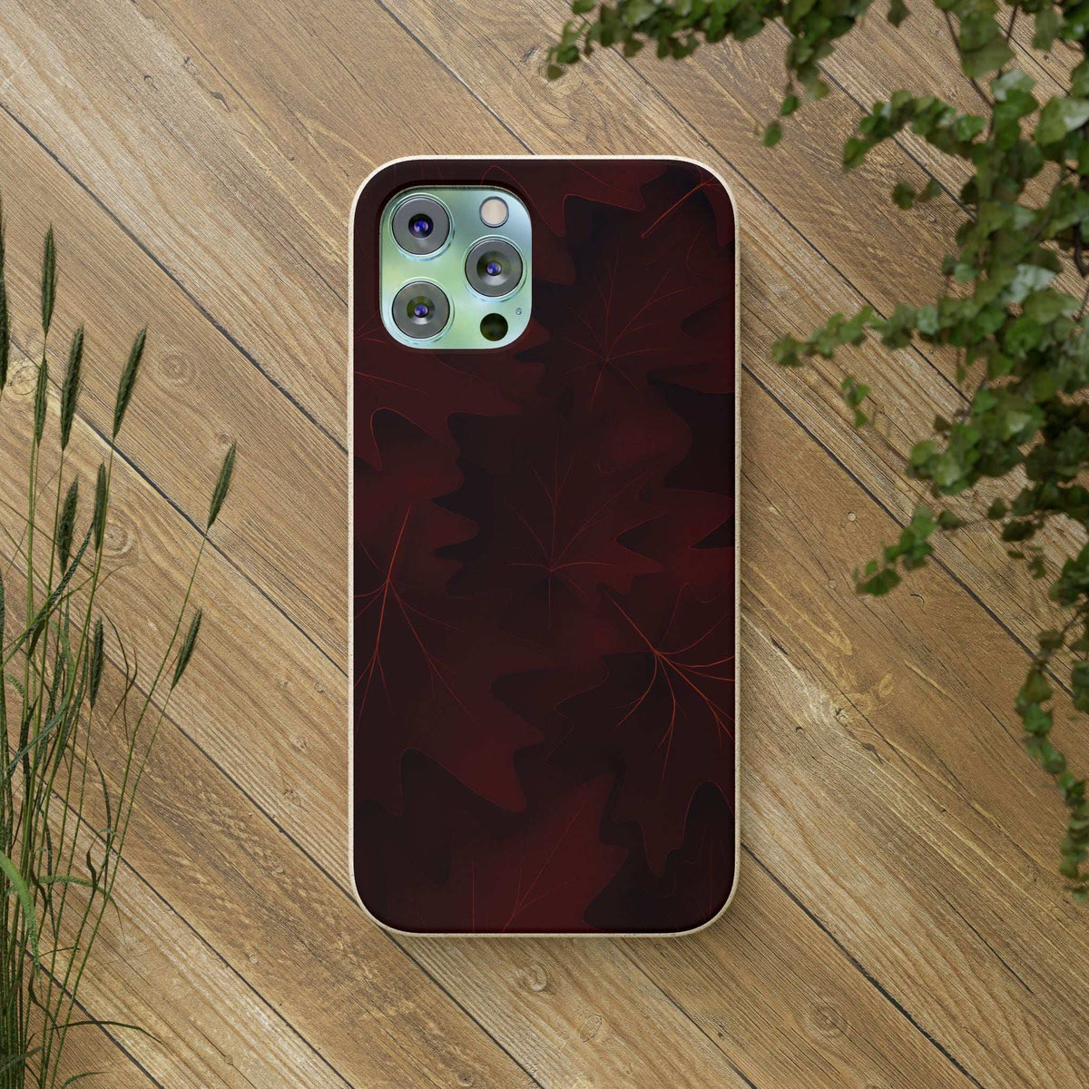 Burgundy autumn leaf phone case with cutouts for camera and flash, slim fit